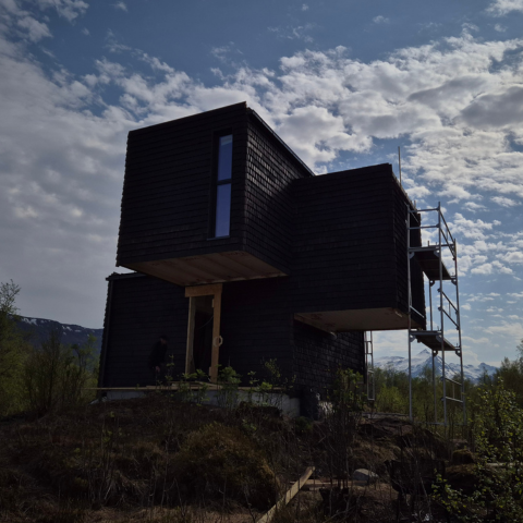 Utendørs fasade av hytte